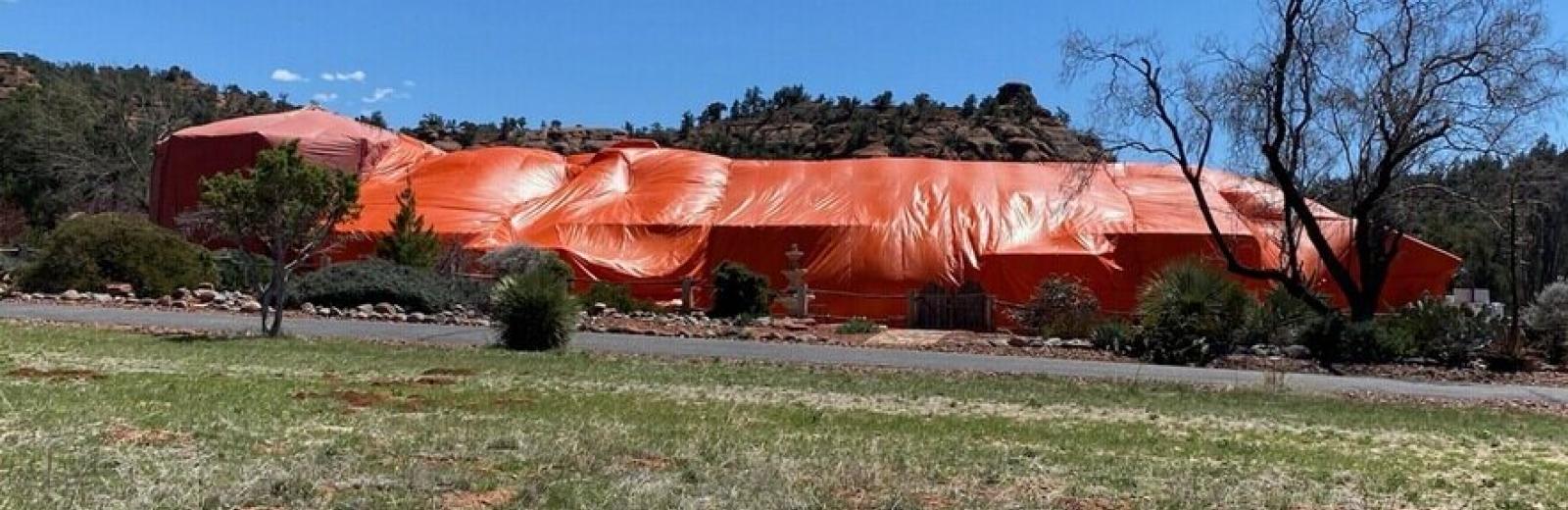 bugwiser fumigation tent over a house