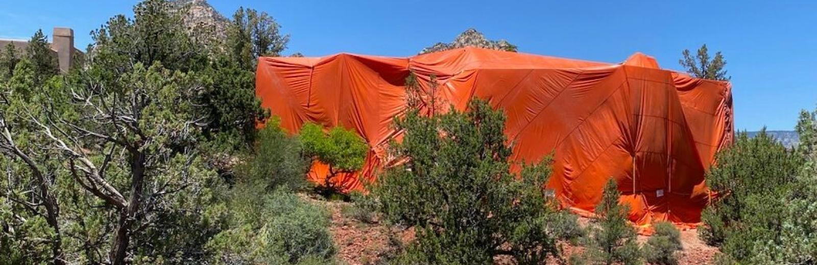 bug wiser fumigation tent over a house