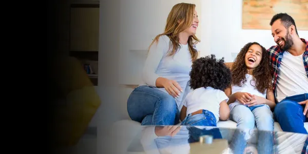 Family laughing in living room